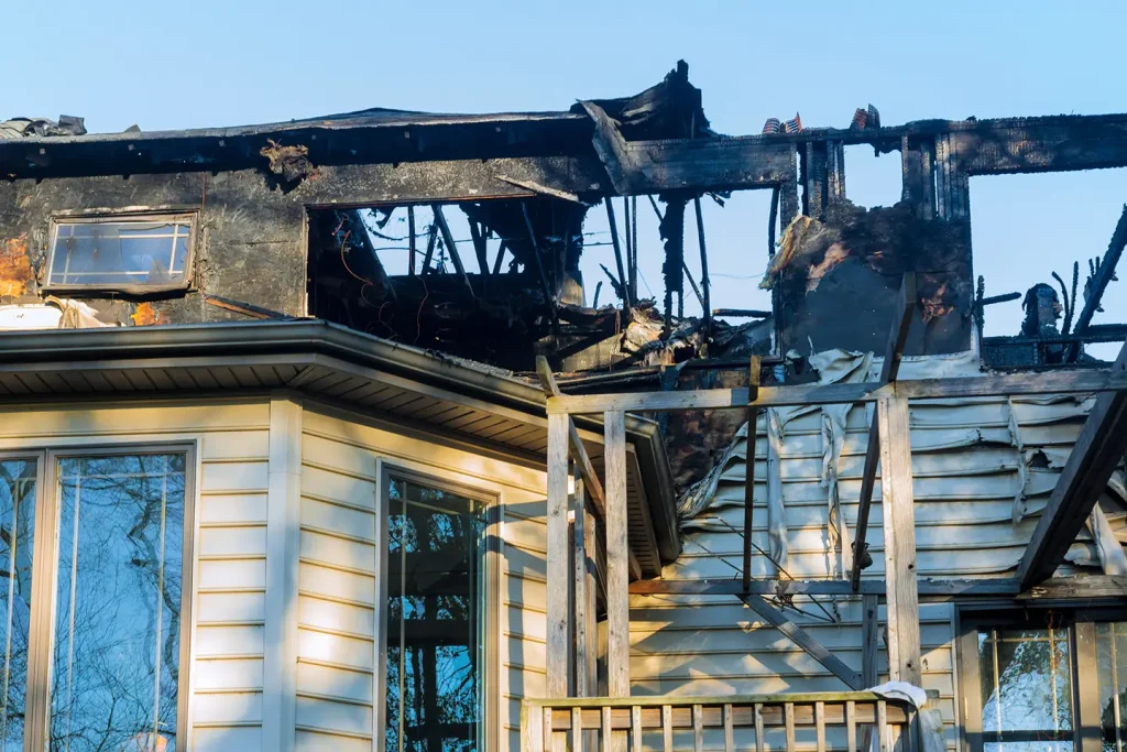 Residential building with extensive fire damage, illustrating the need for professional fire damage restoration in Calgary.