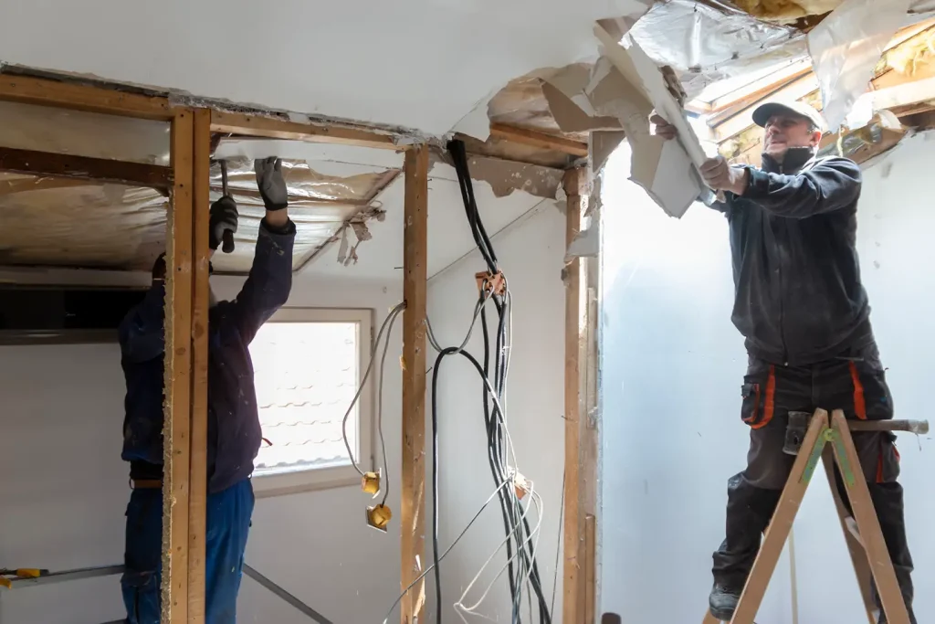 Workers performing interior repairs as part of emergency restoration services in Calgary.