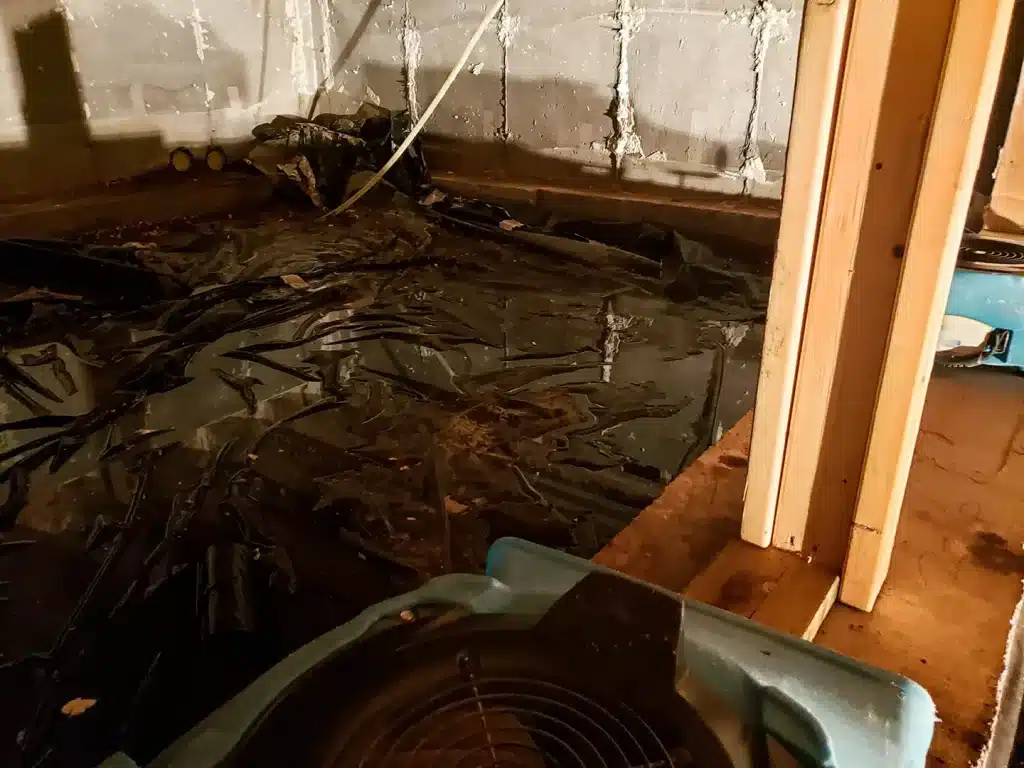 Water and flood damage from fire suppression with drying equipment in a damaged room.
