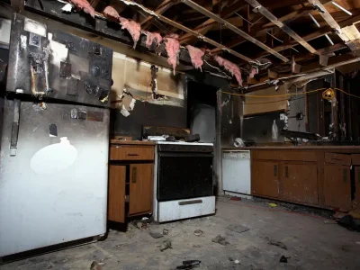 Interior of a kitchen severely damaged by fire.
